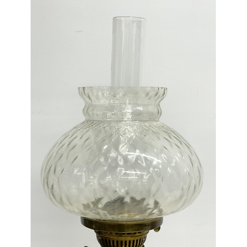 195R - A tall late Victorian brass double burner oil lamp. 70cm