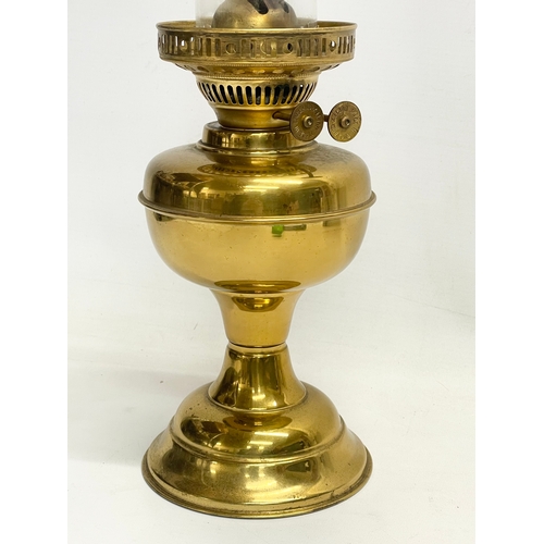 195T - A Edwardian brass double burner oil lamp. 49cm