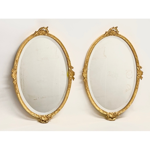 195V - A pair of early 20th century ornate gilt framed mirrors  from William Rodman & Co. Carvers, Gilders ... 