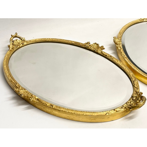 195V - A pair of early 20th century ornate gilt framed mirrors  from William Rodman & Co. Carvers, Gilders ... 