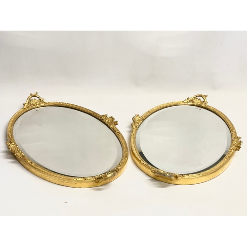 195V - A pair of early 20th century ornate gilt framed mirrors  from William Rodman & Co. Carvers, Gilders ... 