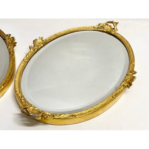 195V - A pair of early 20th century ornate gilt framed mirrors  from William Rodman & Co. Carvers, Gilders ... 