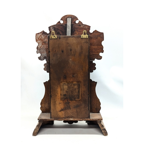 195X - A late 19th century American gingerbread clock with pendulum and key. 36x57.5cm