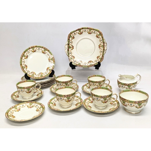 719 - A 20 piece vintage Sutherland tea set, including cake plate.