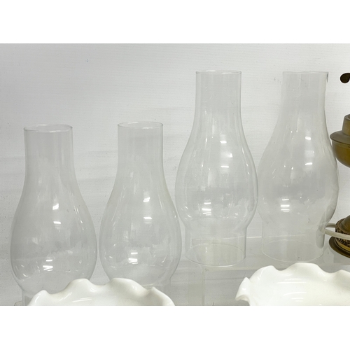 196L - A sundry lot. Including 5 vintage glass shades 21x17cm, 4 funnels and a vintage electric bass lamp.