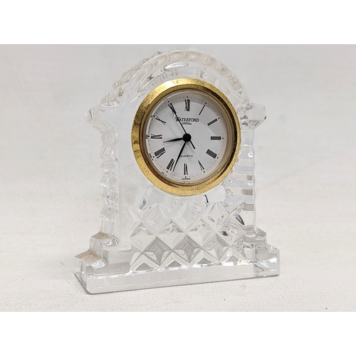 722 - A set of 6 Waterford Crystal glasses with a Waterford Crystal mantle clock. Clock measures 6.5x7.5cm