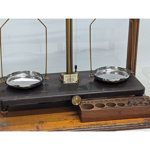 207A - A set of Edwardian scales by Griffin & Tatlock Ltd in case. 45.5x39.5cm