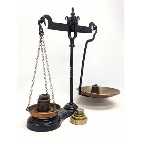 207D - A set of late Victorian cast iron scales with weights. 47.5cm