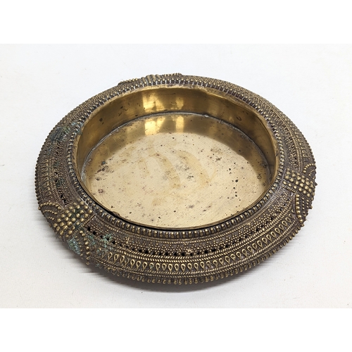 711 - A vintage brass ornate console bowl. 22cm