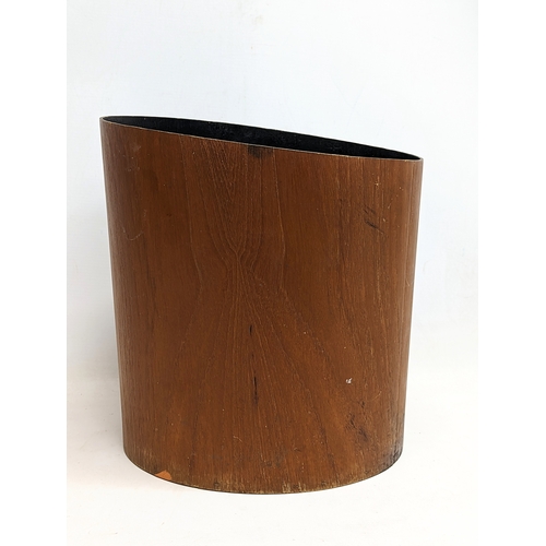 196U - A Mid Century teak paper waste bin by Mallod. 29x30cm