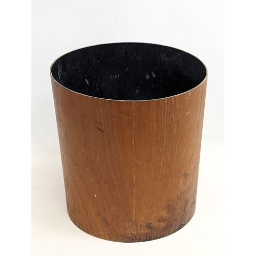 196U - A Mid Century teak paper waste bin by Mallod. 29x30cm