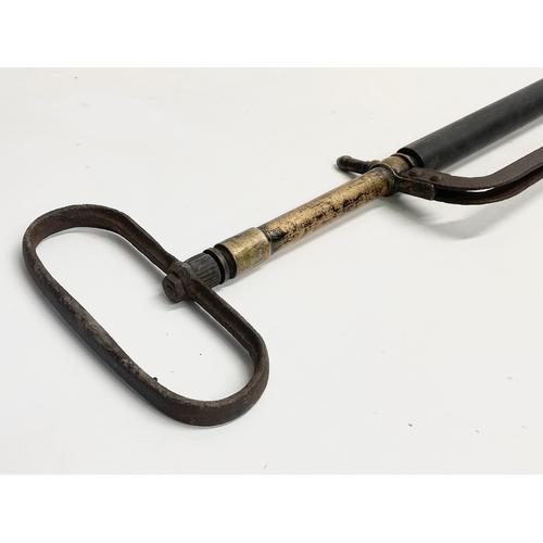 389I - A vintage Stirrup pump. 72cm