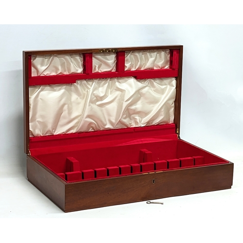 713 - A large mahogany cutlery case. 64x37x13cm