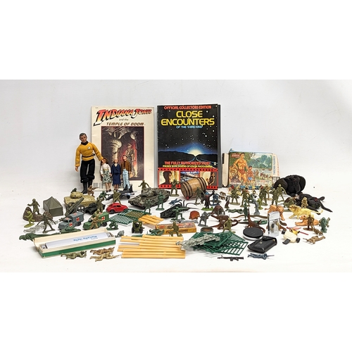 376H - A collection of toys including miniature action figures, a 1970s MatchBox Volkswagen Beetle, A Corgi... 