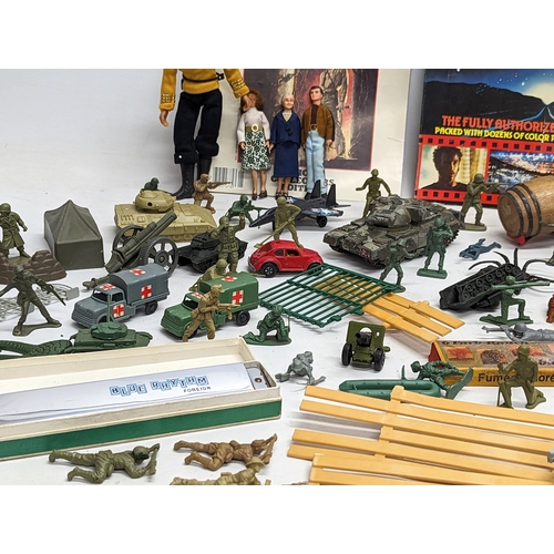 376H - A collection of toys including miniature action figures, a 1970s MatchBox Volkswagen Beetle, A Corgi... 