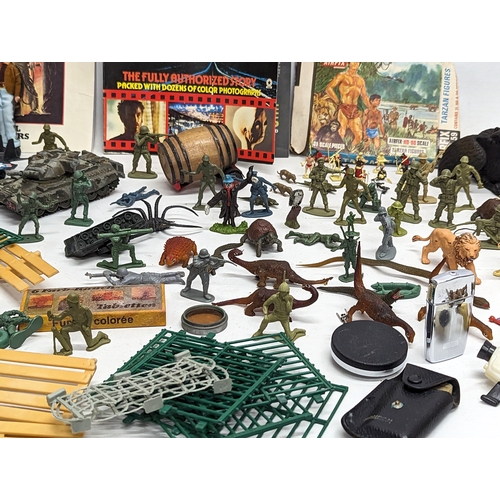 376H - A collection of toys including miniature action figures, a 1970s MatchBox Volkswagen Beetle, A Corgi... 