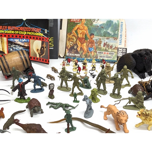 376H - A collection of toys including miniature action figures, a 1970s MatchBox Volkswagen Beetle, A Corgi... 