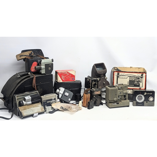 376Q - A large collection of vintage cameras including Sankyo, Eumig, Canon, etc