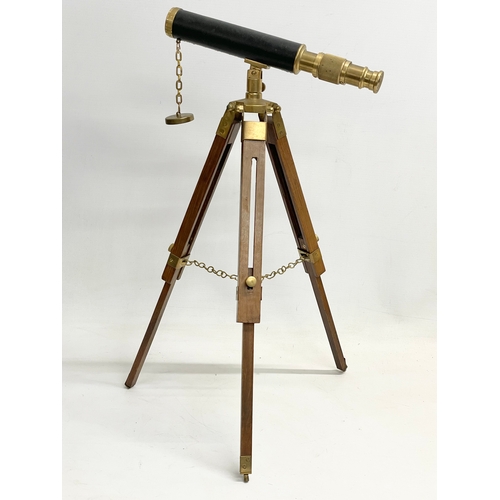 184G - A small telescopic tabletop microscope. Fully extended 48cm