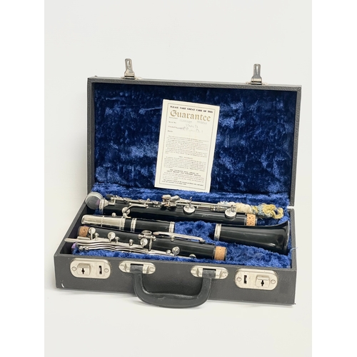 376T - A clarinet in case by Roosey & Hawkes, London. Case measures 35x20x10cm