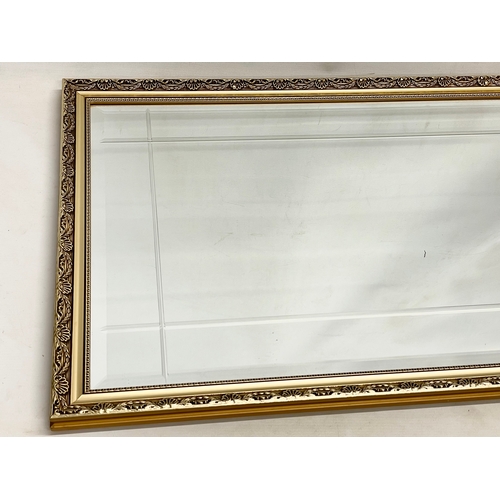 185S - A gilt framed mirror. 58x83cm