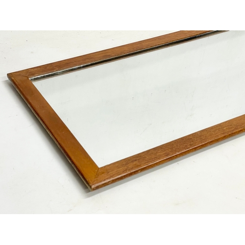 280C - A long Danish Mid Century teak framed mirror. 126x36cm