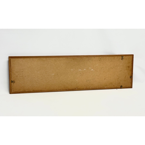 280C - A long Danish Mid Century teak framed mirror. 126x36cm