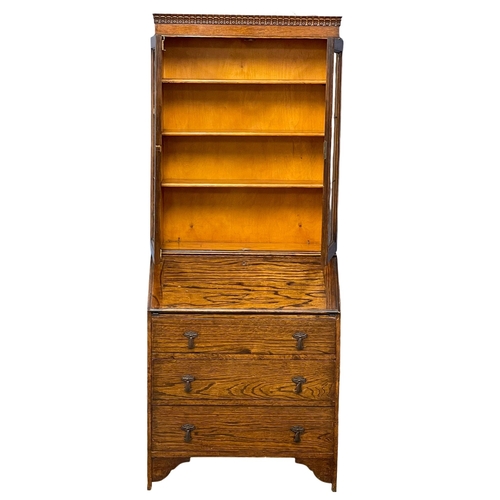 150 - A 1930’s oak bureau bookcase. 75x43x185.5cm