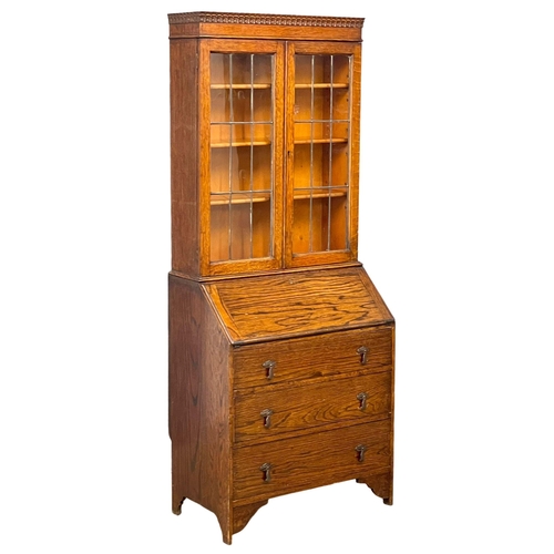 150 - A 1930’s oak bureau bookcase. 75x43x185.5cm