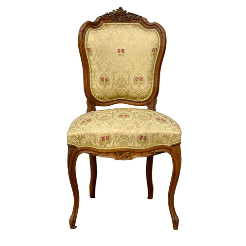 153 - A late 19th century French fruitwood side chair. Reupholstered.