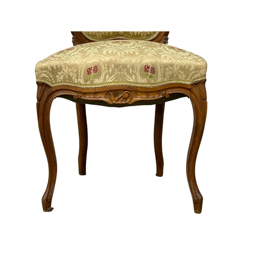 153 - A late 19th century French fruitwood side chair. Reupholstered.