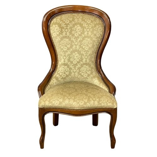 180 - A Victorian style mahogany spoon back chair.