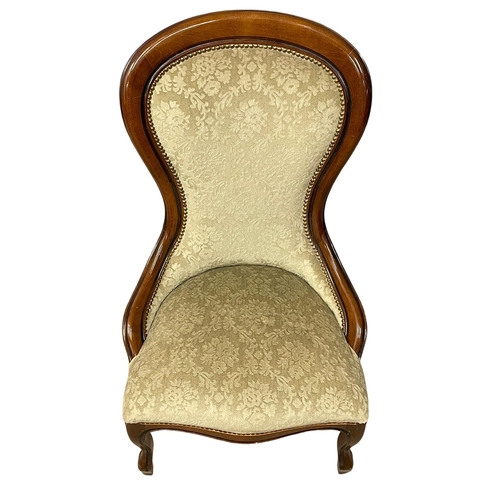 180 - A Victorian style mahogany spoon back chair.