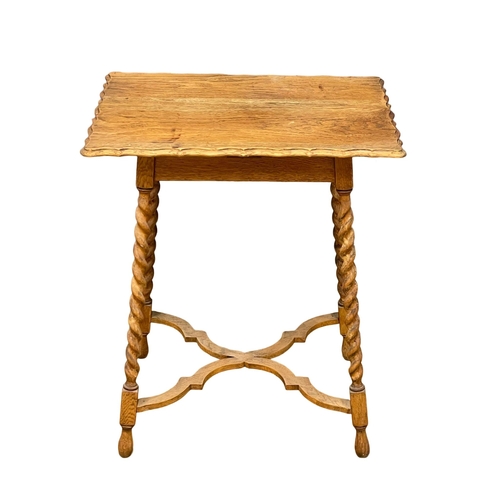 201 - A 1920’s oak occasional table on Barley Twist legs. 61x46x71cm