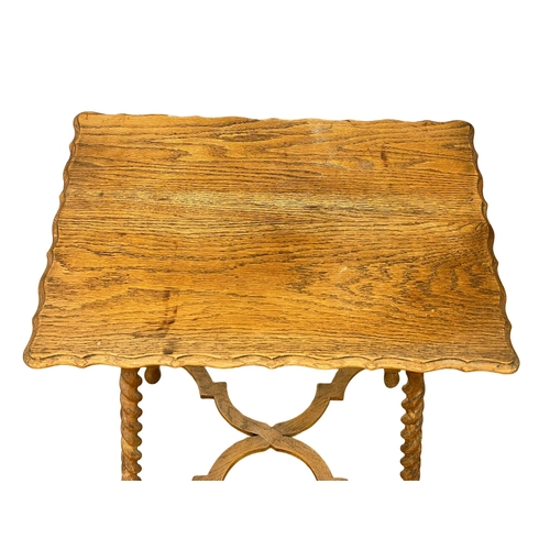 201 - A 1920’s oak occasional table on Barley Twist legs. 61x46x71cm