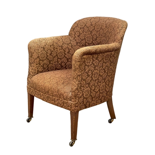 206 - A 1920’s tub armchair. 63x61x83cm