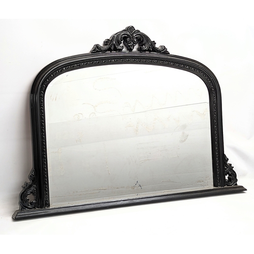 379T - A large bevelled overmantel mirror. 127x91.5cm