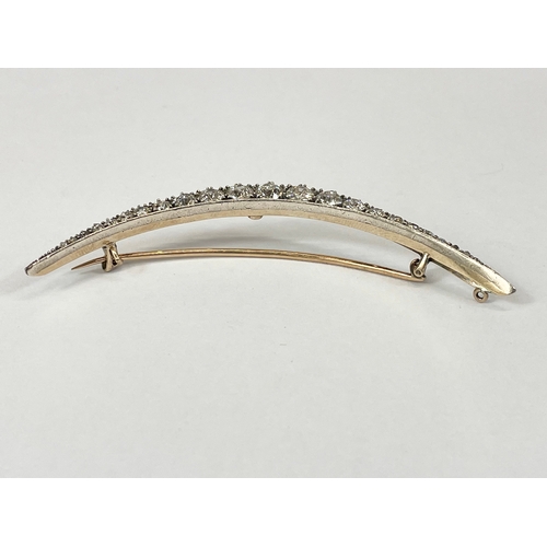 598C - An excellent quality 18ct gold diamond crescent brooch. 23 old cut diamonds from 1.5mm to 4.7mm. Tot... 