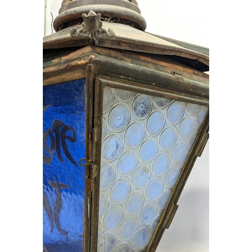 265J - An large late 19th century copper lantern with stained glass panels. 44x73cm