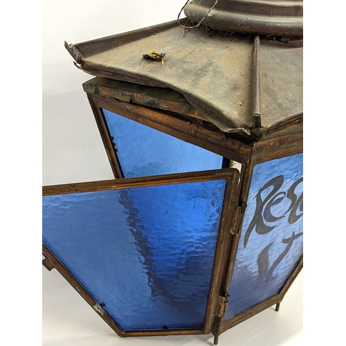 265J - An large late 19th century copper lantern with stained glass panels. 44x73cm