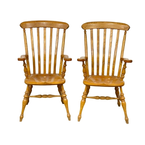 195I - A pair of large Victorian style Ash Country House armchairs.