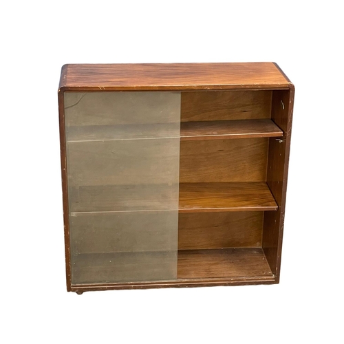 195M - A 1930’s Art Deco Walnut bookcase with 2 shelves. 76x25x78cm