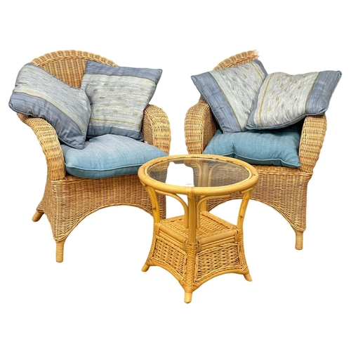 196M - A pair of Edwardian style wicker armchairs with glass top table. Chairs measure 68x60x89cm