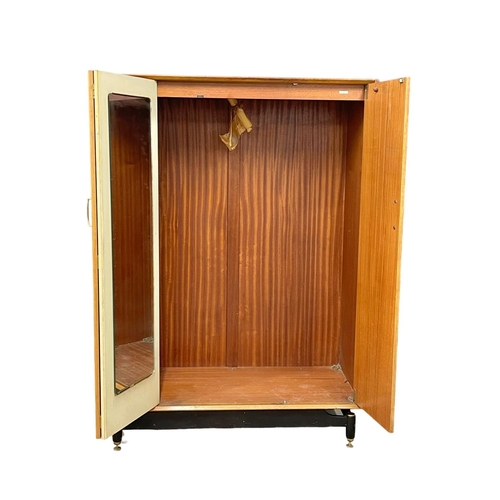 237 - A G-Plan Librenza Mid Century teak wardrobe. E.Gomme. 1950’s. 122x57x172cm