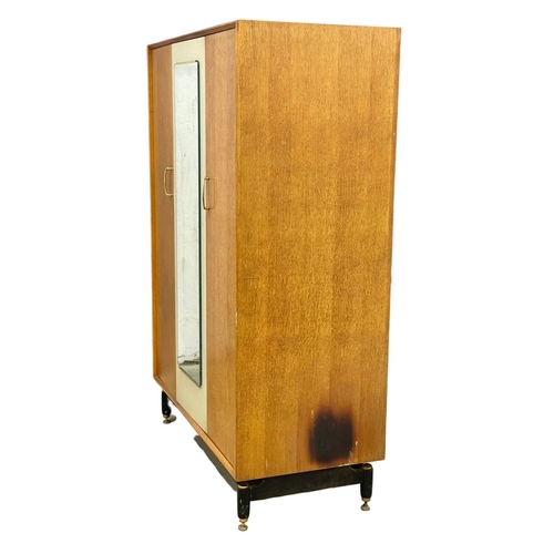 237 - A G-Plan Librenza Mid Century teak wardrobe. E.Gomme. 1950’s. 122x57x172cm