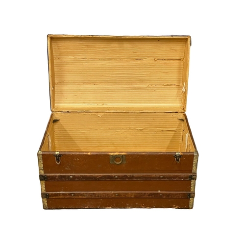 247D - An early 20th century dome top trunk. 91x52x55.5cm