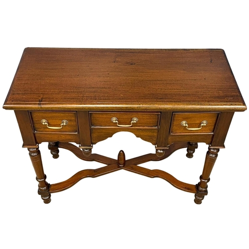 255 - A good quality mahogany side table with 3 drawers and stretcher support. 100x43x80cm