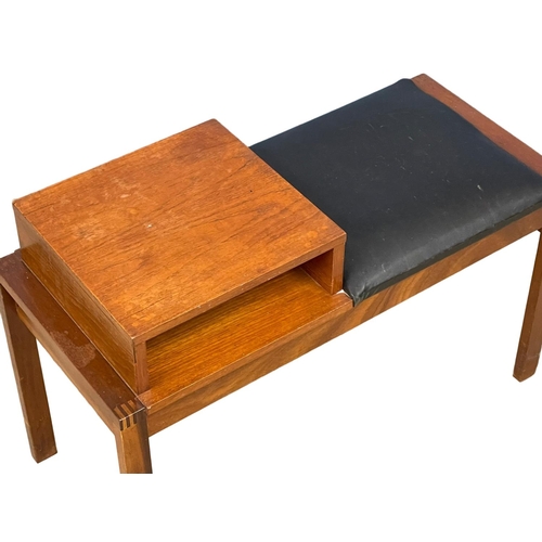 258 - A Mid Century teak telephone table with black vinyl seat. 81x36x55cm