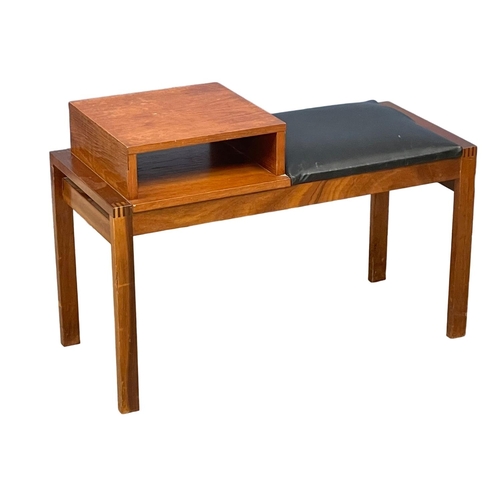 258 - A Mid Century teak telephone table with black vinyl seat. 81x36x55cm