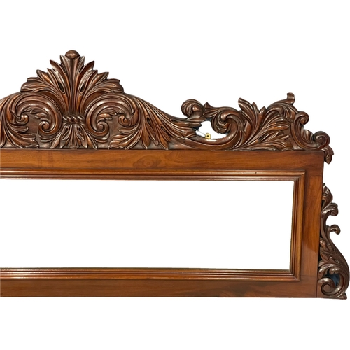 1075 - A large Victorian carved mahogany mirror. 168x76.5cm